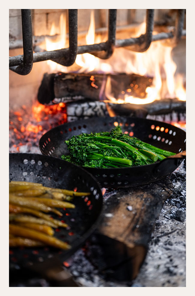 Vaquera vegetables cooking over flame